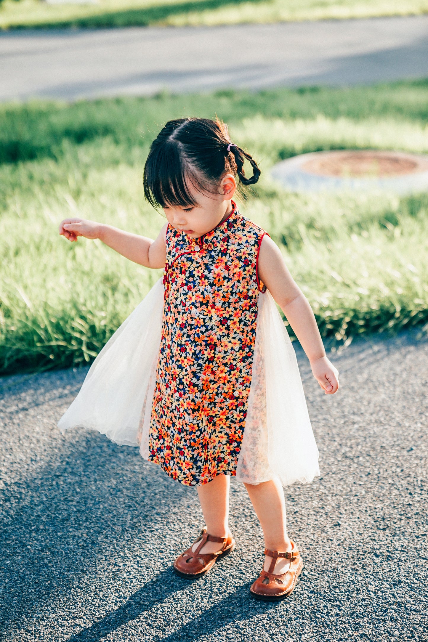 Floral qipao-inspired girls' dress lifestyle photograph
