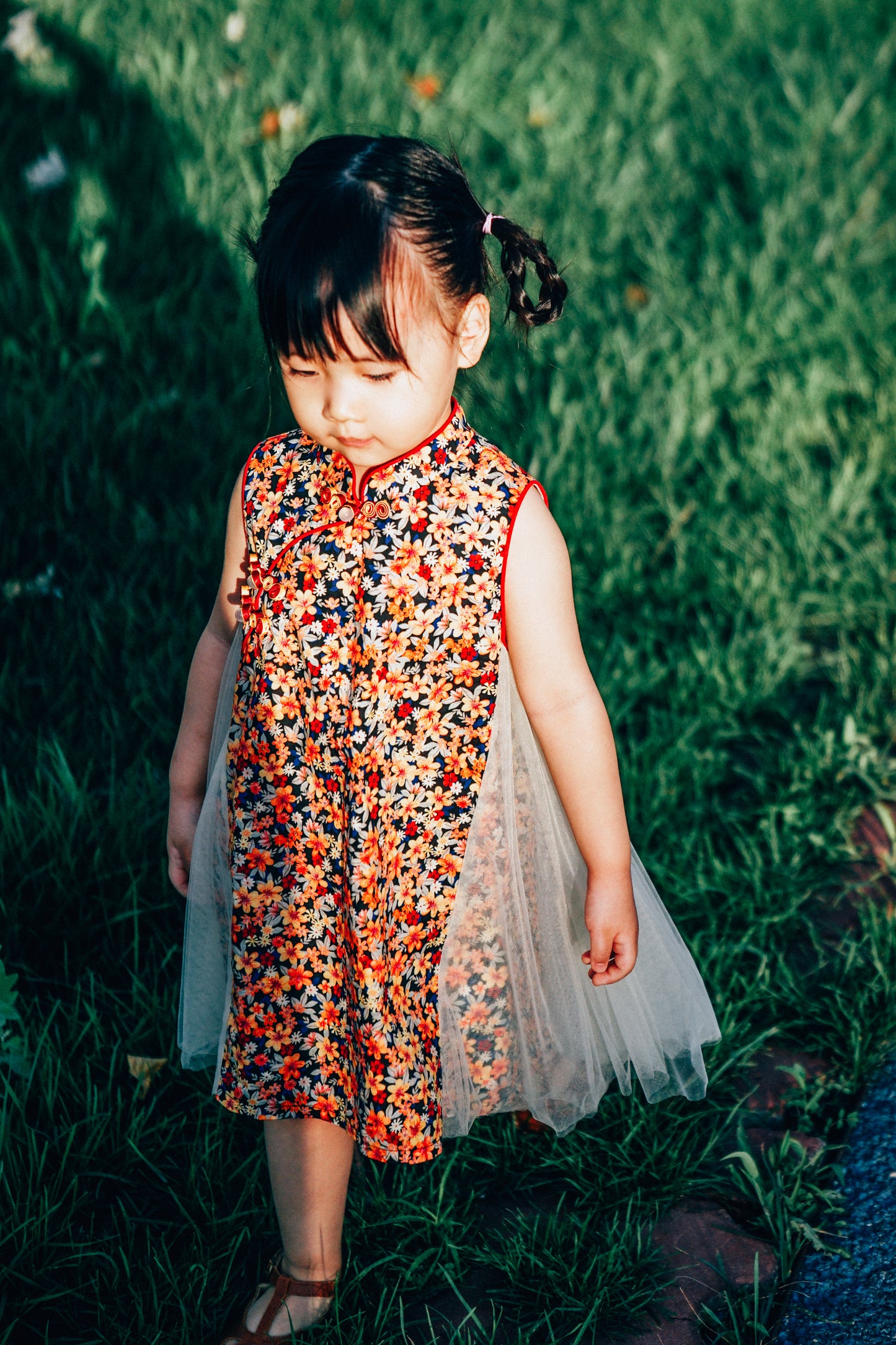 Girls' navy floral dress with airy ivory tulle side panels