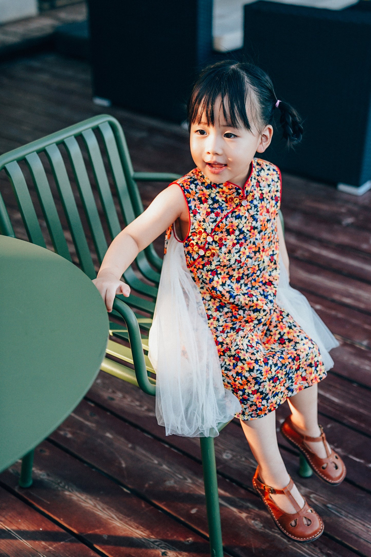 Navy floral qipao dress with ivory side tulle, lifestyle view