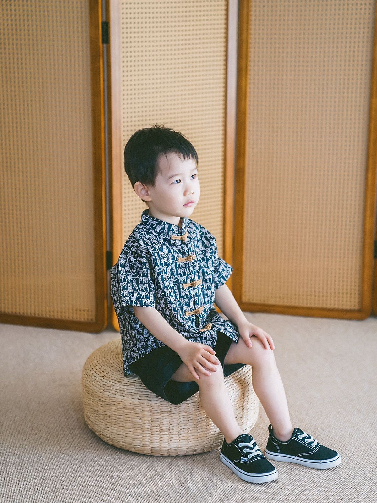 Boy in an Animal Print Mandarin-collar set for a warm-weather celebration