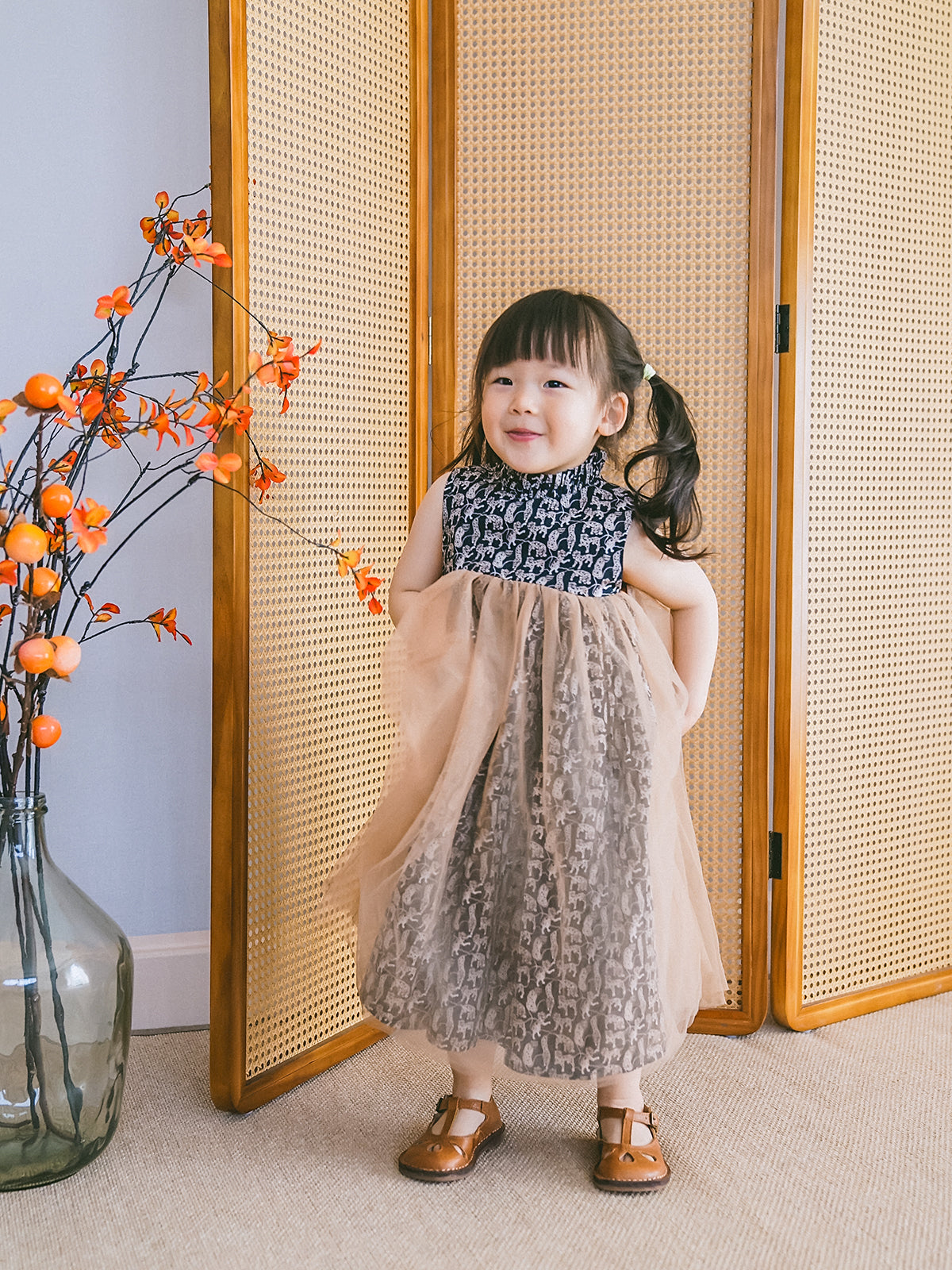 Girl in a black-and-white animal-print cotton and tulle party dress