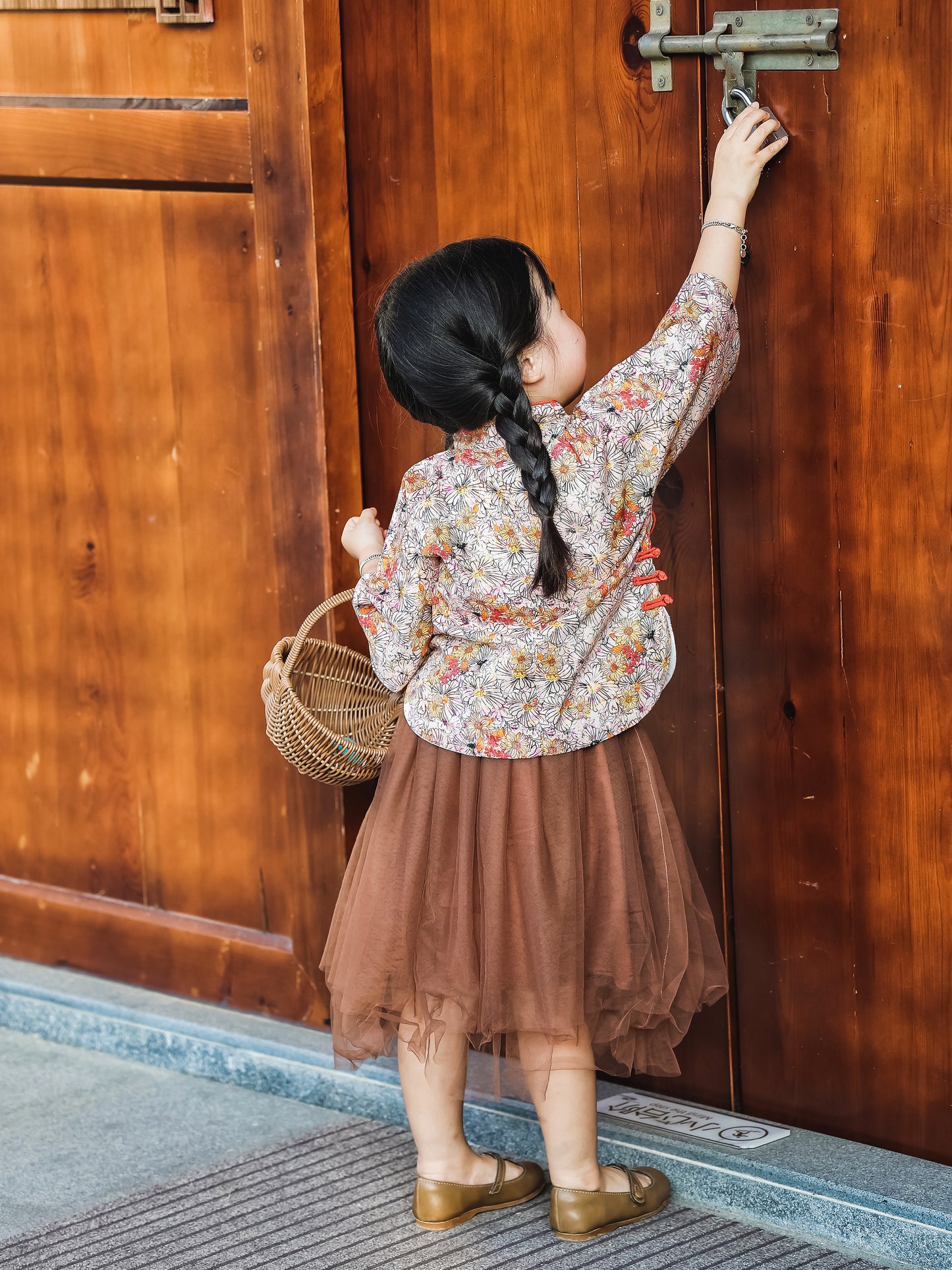 Back view of the floral Mandarin top and chestnut tulle skirt set