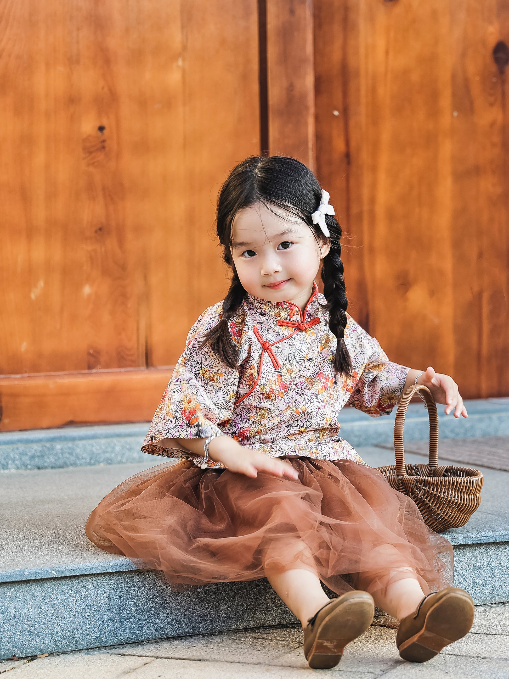 Front view of the floral Mandarin top and chestnut tulle skirt set