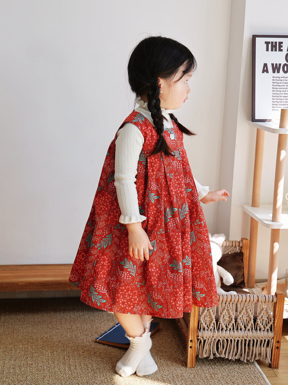 Side view of Holiday Bloom red floral dress with white knit layer