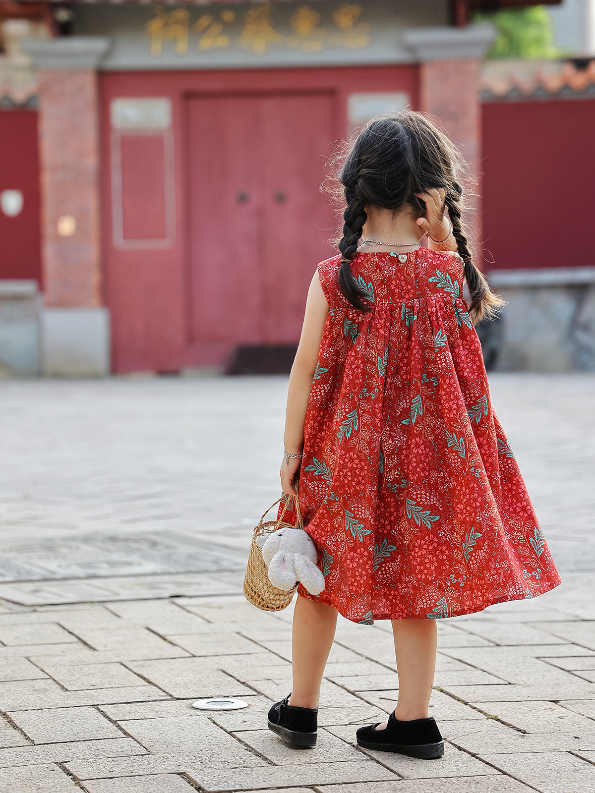 Back view of Holiday Bloom red floral sleeveless dress