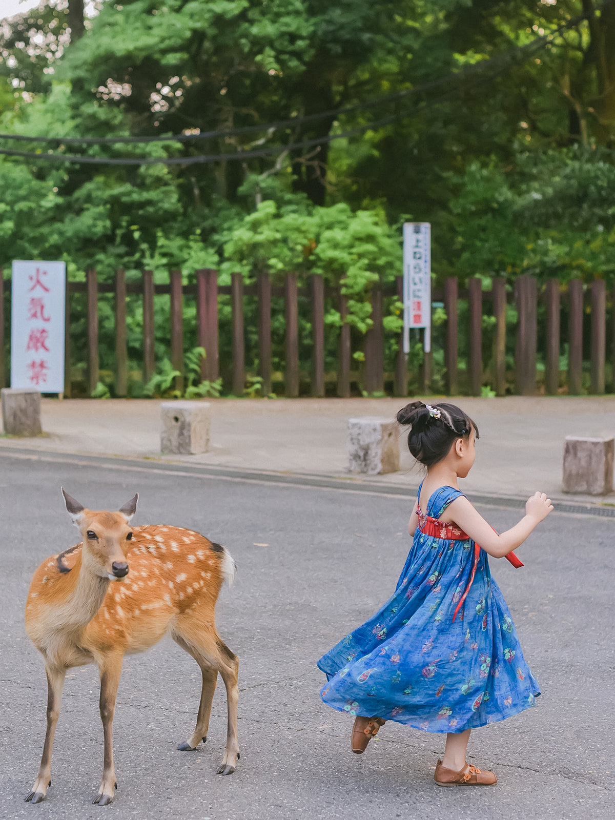 Girl wearing the Indigo Ember Hanfu-inspired dress outdoors