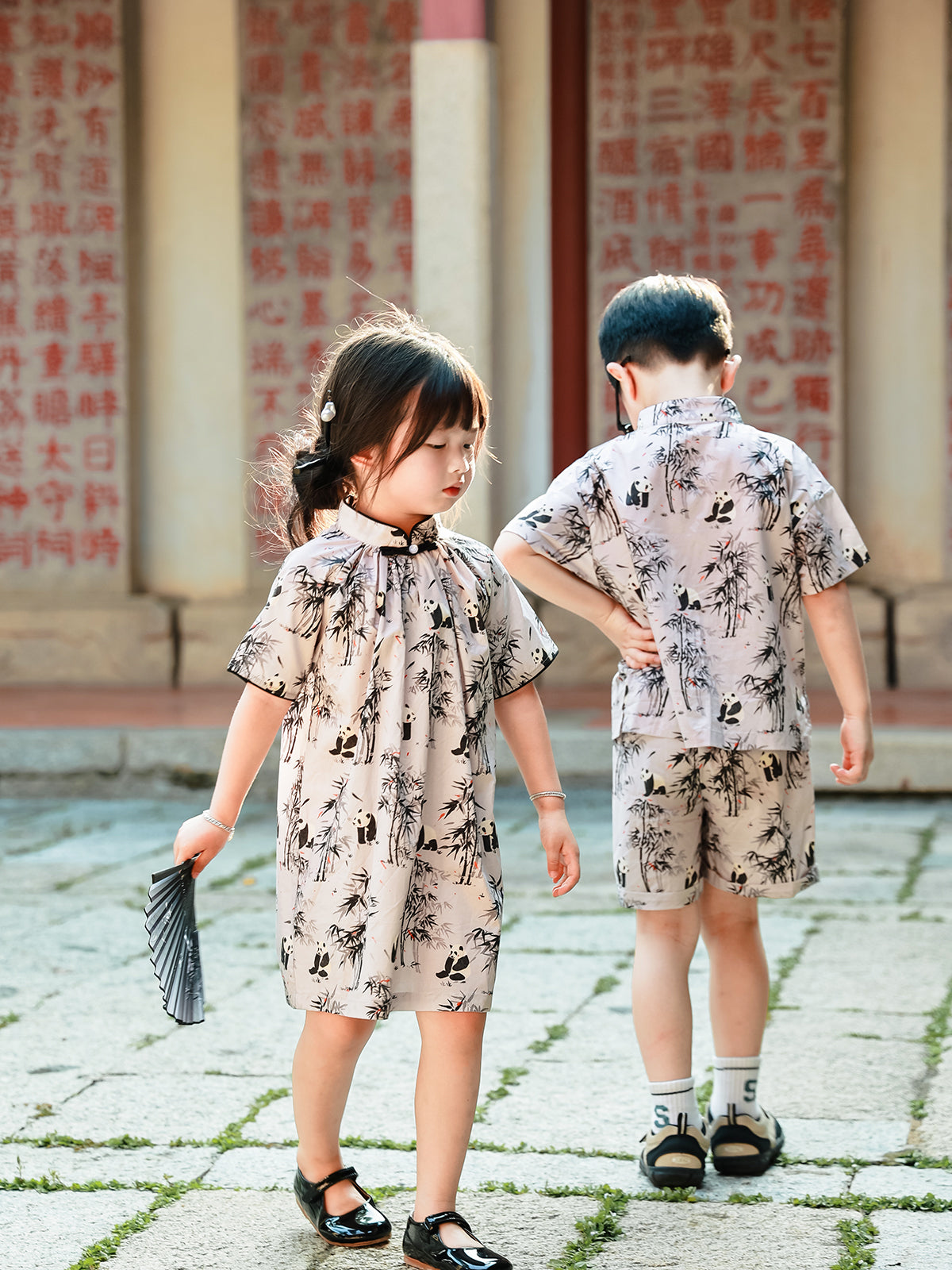 Sibling matching Panda Bamboo outfits back view