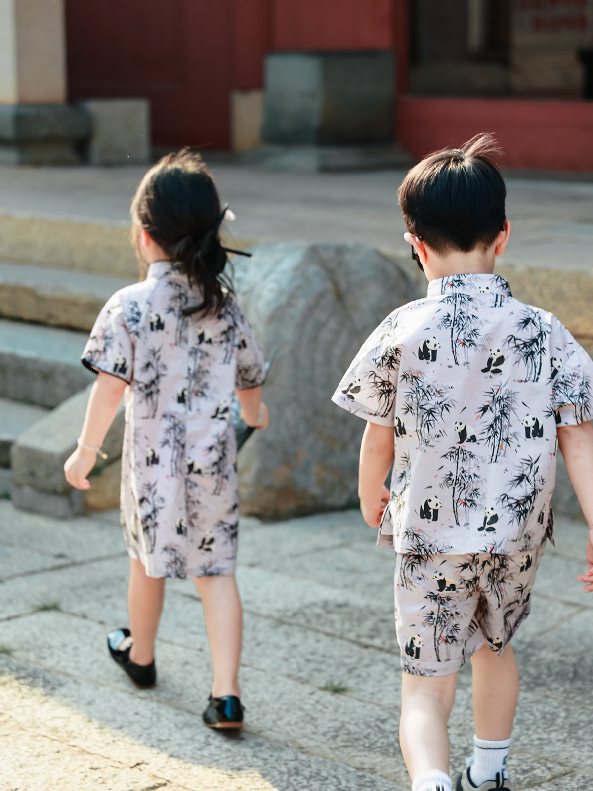 Sibling matching Panda Bamboo outfits back view