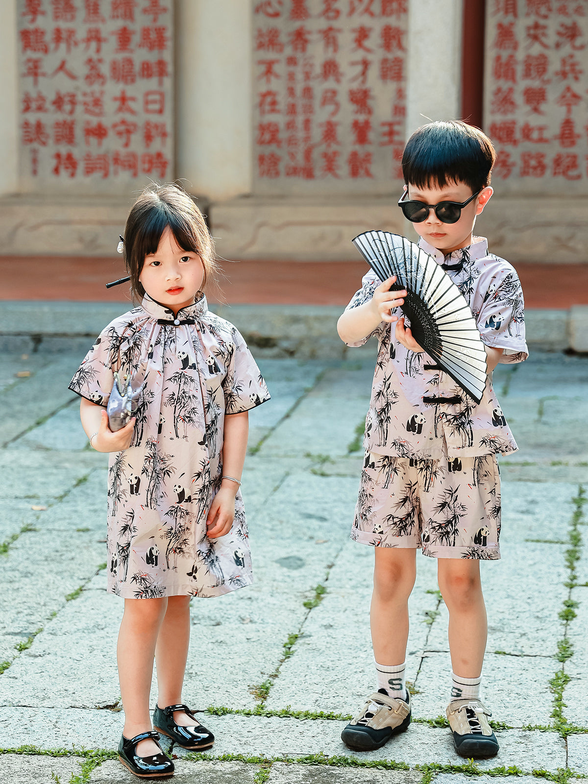 Sibling matching Panda Bamboo outfits full length