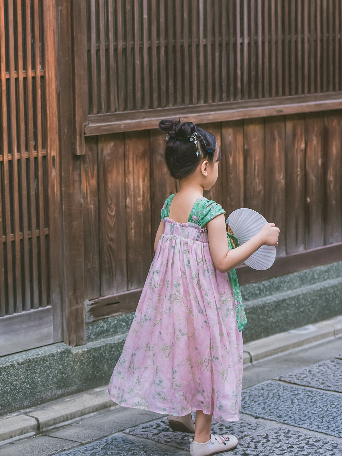 Spring Blush girls' blush pink and green Hanfu-inspired dress, lifestyle photo